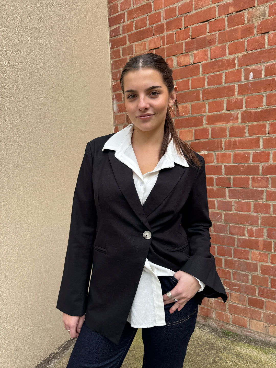 Stella wearing the sunny girl black blazer