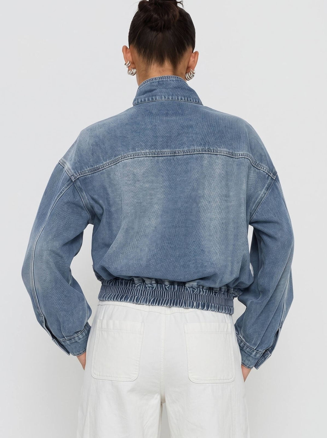 back detail of a denim bomber jacket by smaibulun