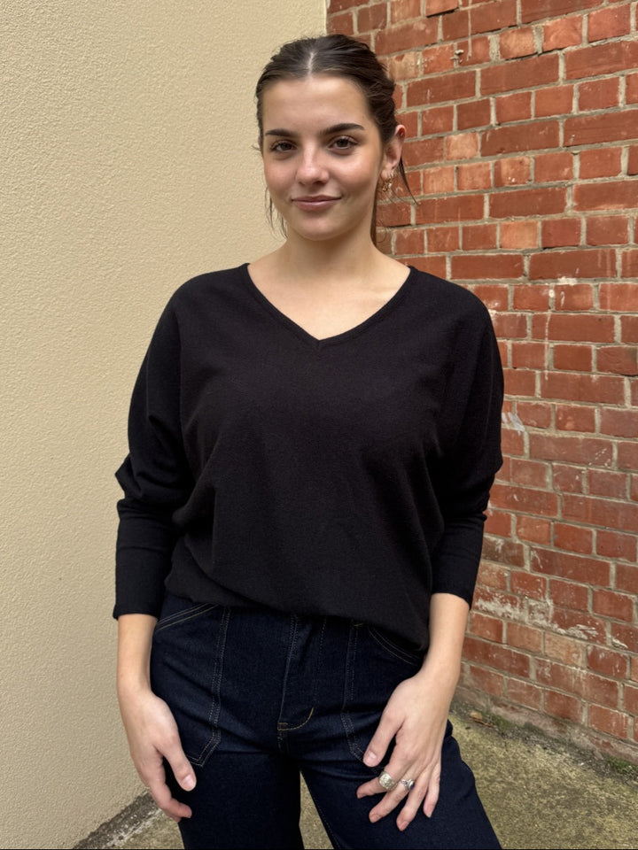 Stella wearing a black sunny girl jumper.