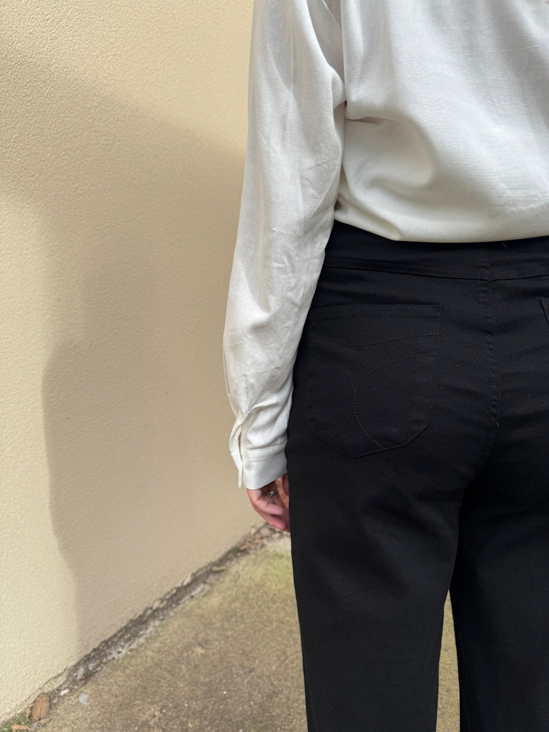 Close-up of a person wearing a white sunny girl shirt .