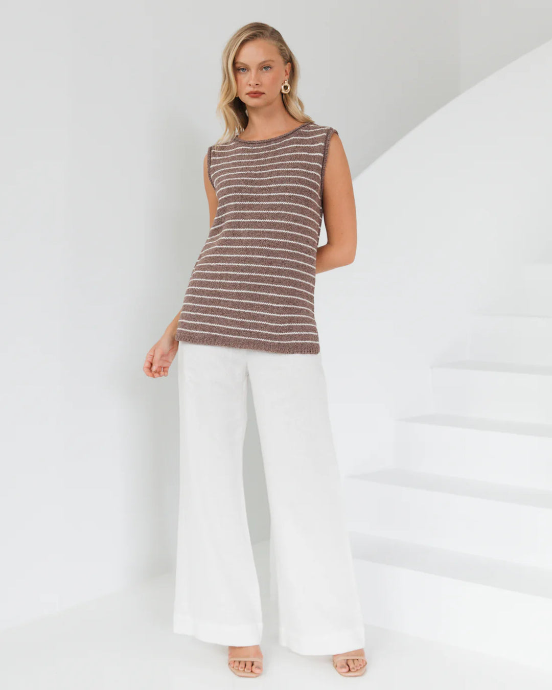 stripe tank top by white closet
