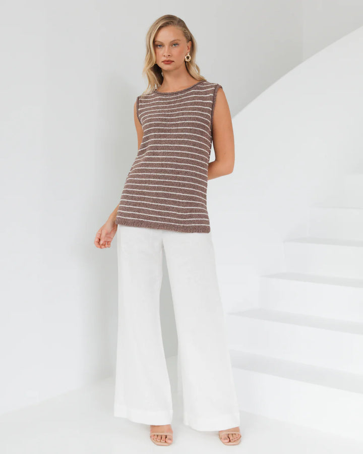 stripe tank top by white closet
